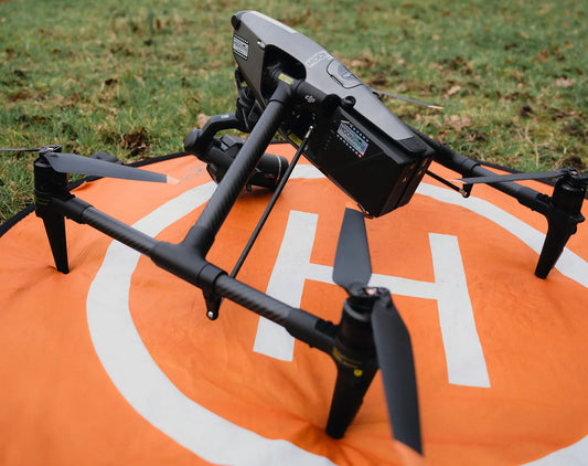 DJI Inspire 3 drone on an orange landing pad, ready for drone hire in London